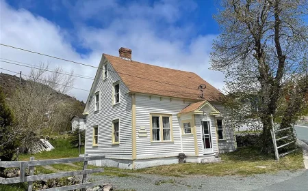 $199,999 Historic Petty Harbour Saltbox Home: Coastal Charm Awaits