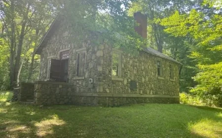 $104,900 Historic Harrison MI Stone Schoolhouse: Unique Home & Wooded Acreage