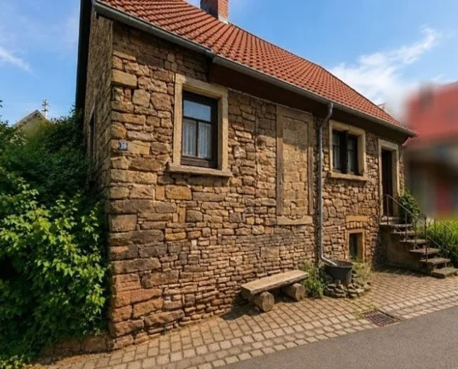 65.000 € Historic Stone House in Gerbach, Germany: Renovation Opportunity