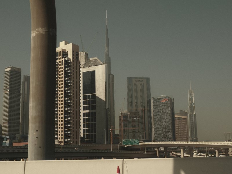 City skyline featuring modern skyscrapers under a hazy sky.