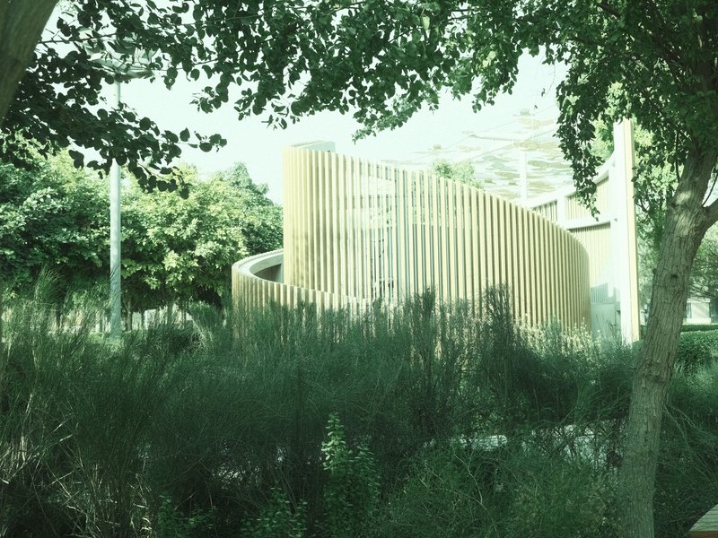 A modern architectural structure surrounded by greenery, featuring curved wooden elements.