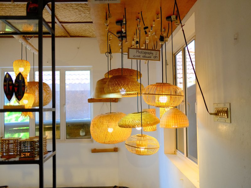 Hanging woven lamps in a bright indoor setting with natural light filtering through windows.