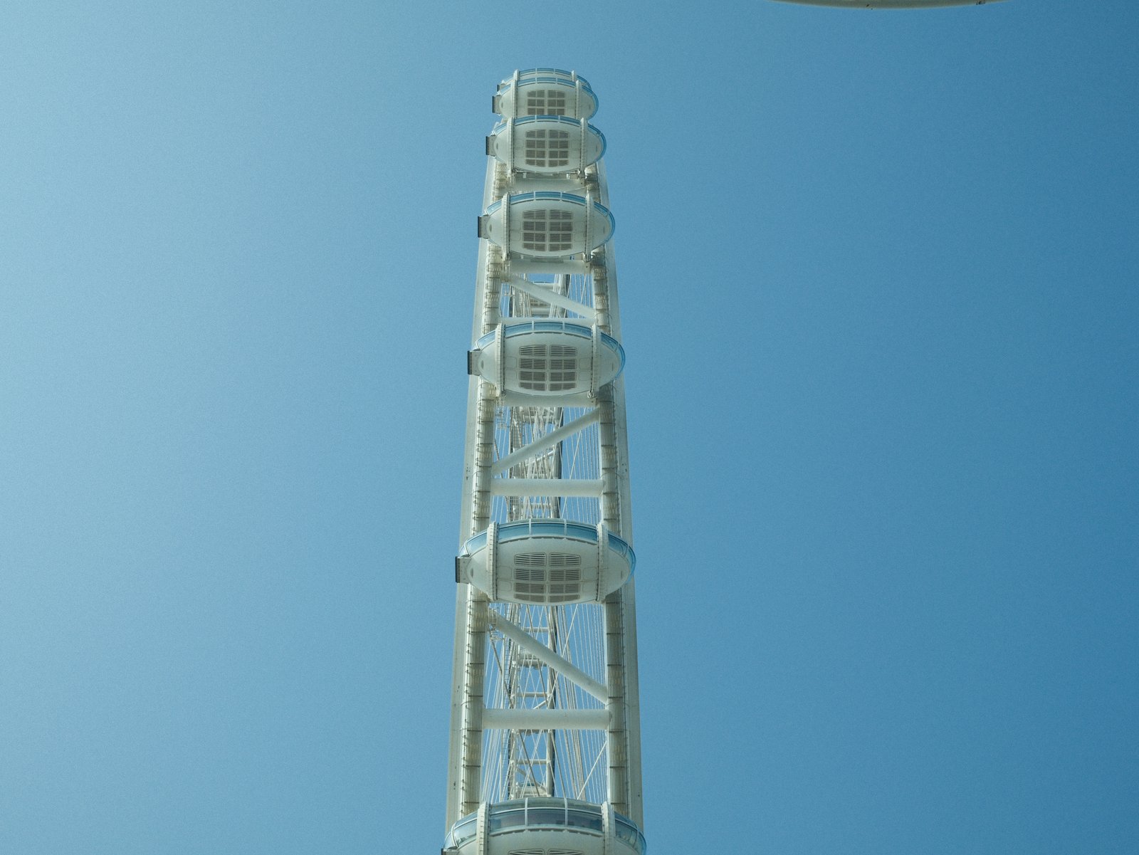 A tall observation tower against a clear blue sky.