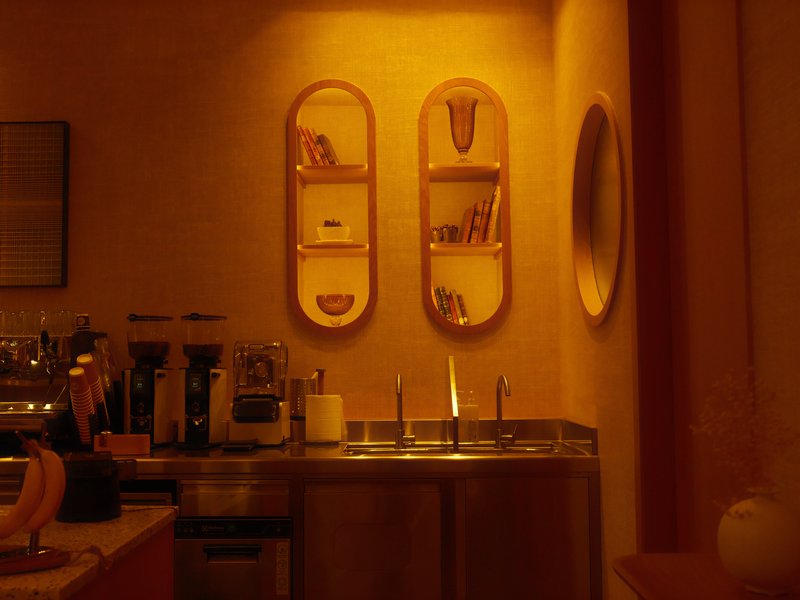 A warm-toned kitchen scene with shelves and a mirror, featuring soft lighting and a cozy atmosphere.