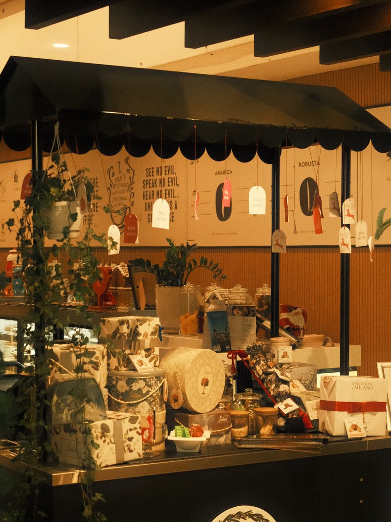 A cozy indoor market stall filled with various handmade crafts and decorative items.