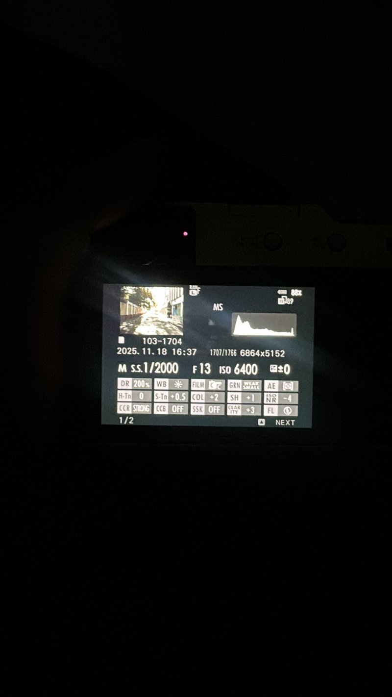 Camera display showing settings and exposure information in low light.