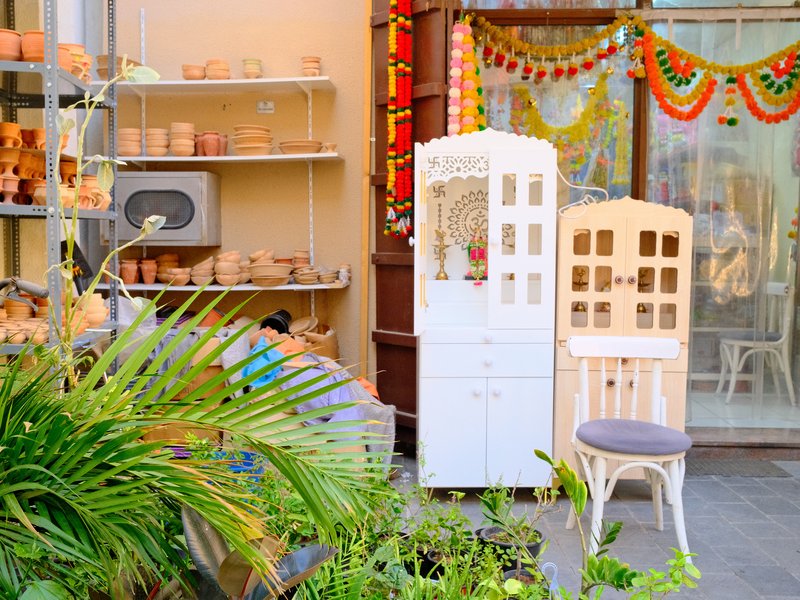 A charming outdoor display of decorative items and furniture in a vibrant setting.