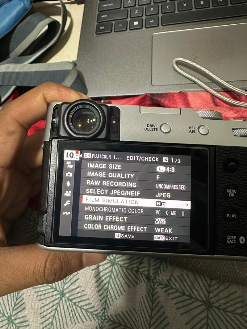 A close-up of a camera's rear display showing settings and options.