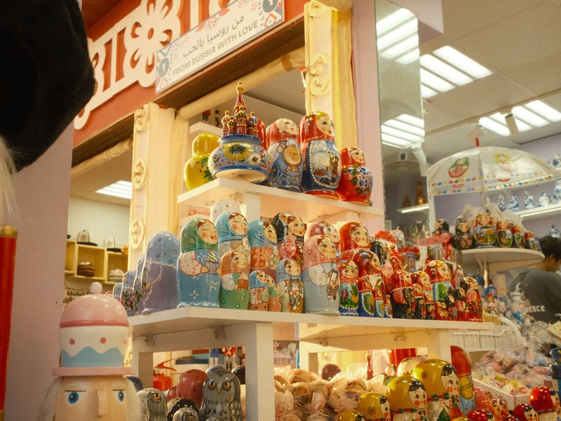 Colorful display of traditional Russian nesting dolls in a shop setting.