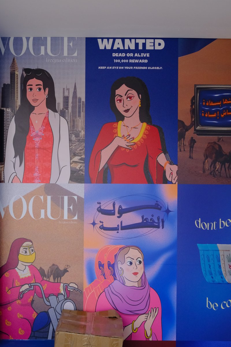 A colorful mural featuring illustrated women and text, with a mix of cultural and modern themes.