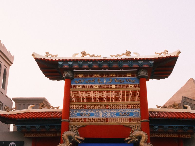 Colorful traditional Chinese architecture with ornate details and a clear sky.