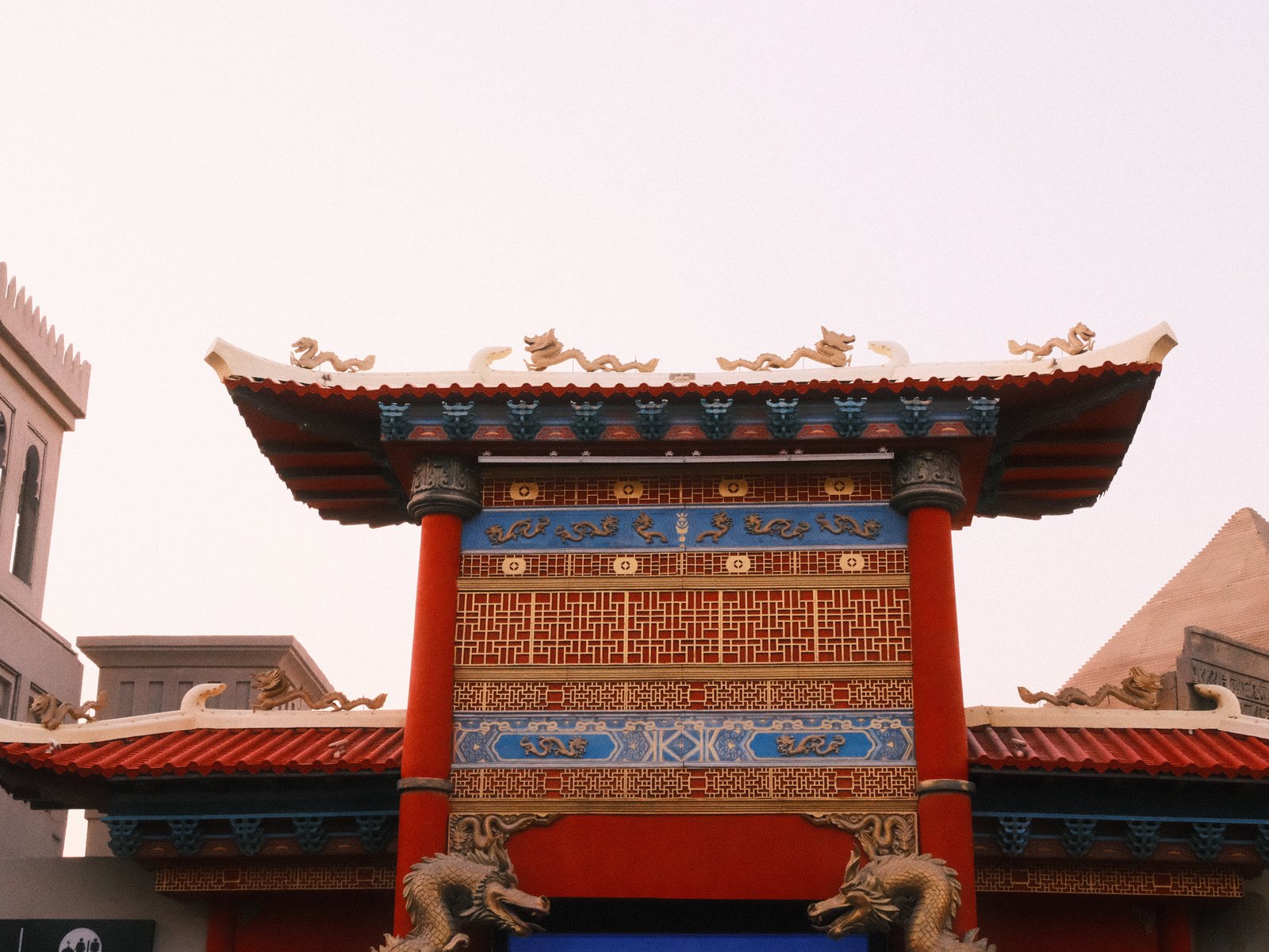 Colorful traditional Chinese architecture with ornate details and a clear sky.