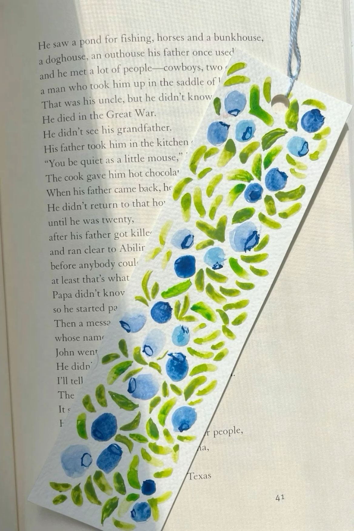 A Hand-Painted Blue Floral Bookmark as a Thoughtful DIY Gift visual reference