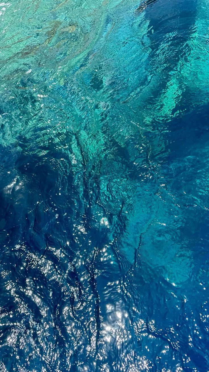 Turquoise Ocean Water from Below: A Study in Light and Movement visual reference