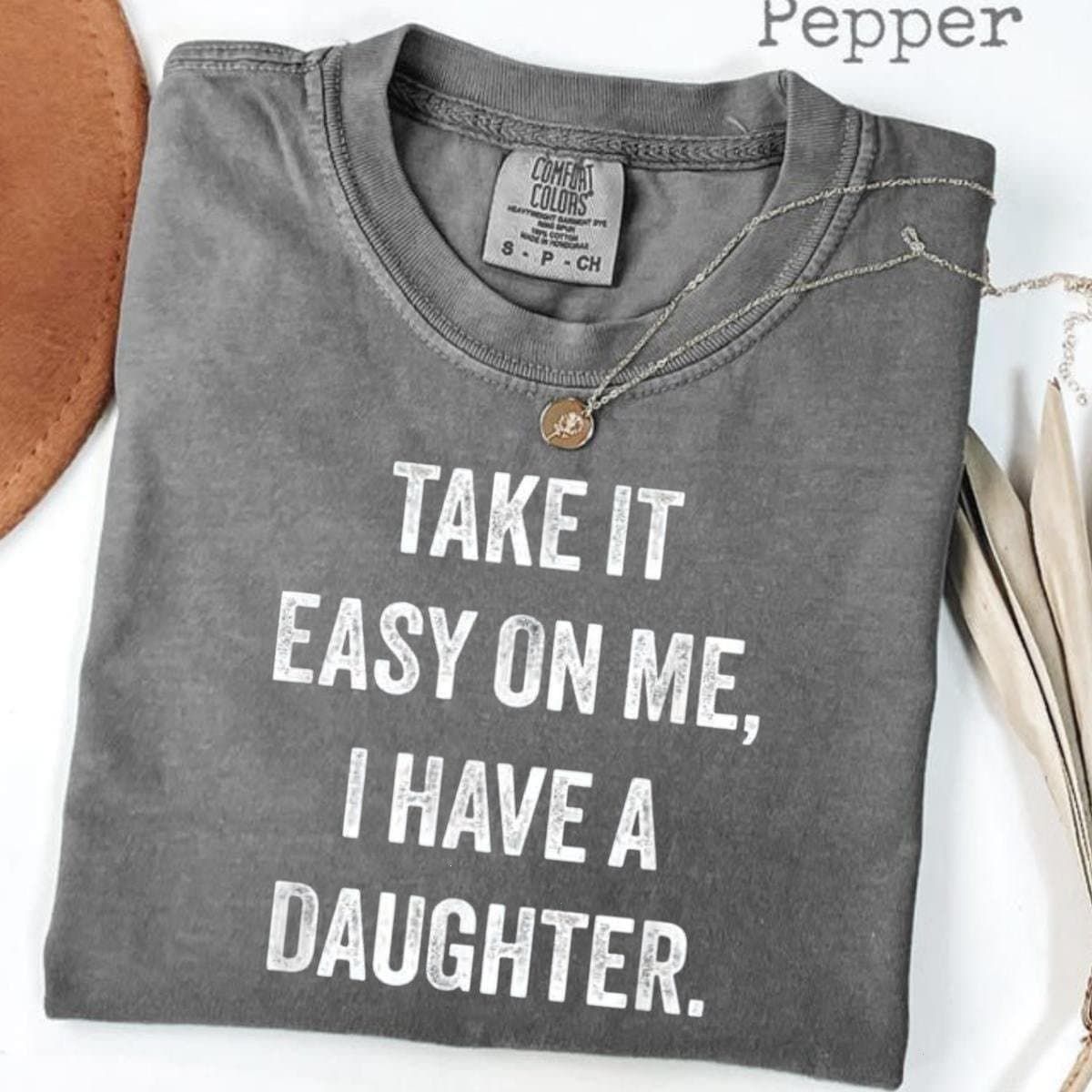Take It Easy On Me I Have A Daughter Shirt, funny dad humor father day gift for girl dad protective dad vibes, dad joke tee, girl dad life, family humor quote, soft cotton casual fit oversized unisex comfy everyday wear