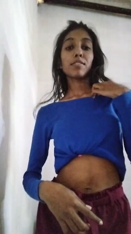 A slender attractive shy adorable Lankan girl slowly dances while exposing her small frame.