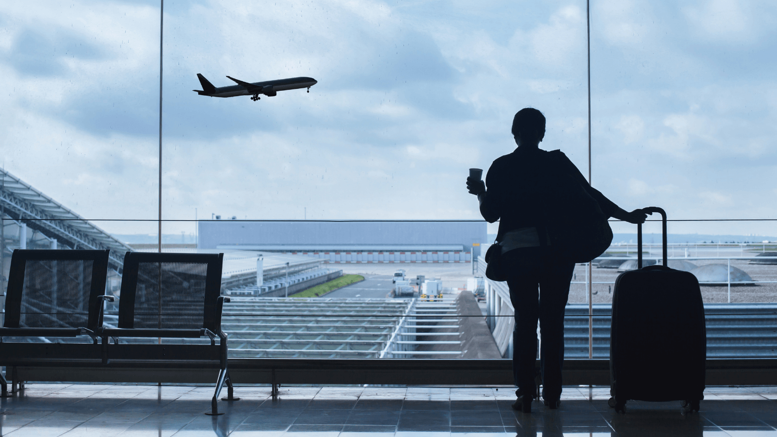 A nanny waiting for a plane at the airport