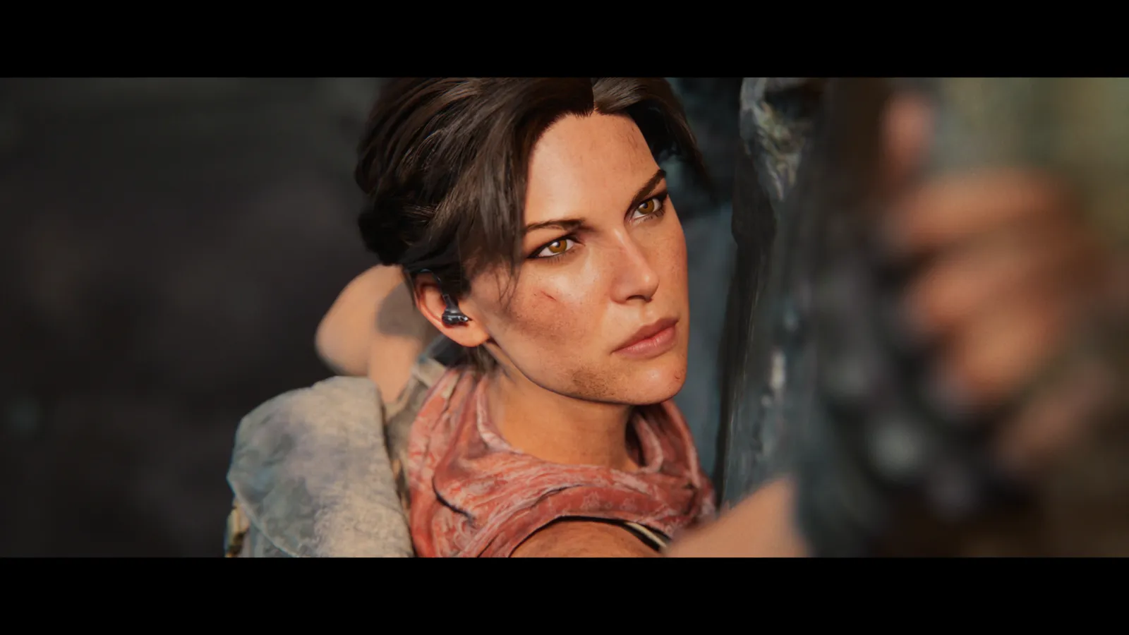 Lara Croft climbing ancient stone ruins in the Tomb Raider: Catalyst announcement trailer still
