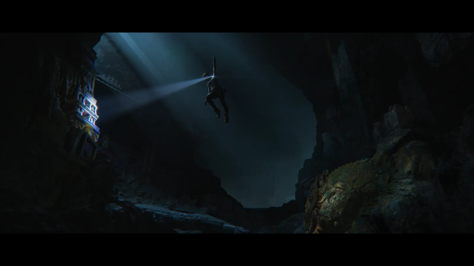 Lara Croft descending a fractured cliff face in Tomb Raider: Catalyst official press image