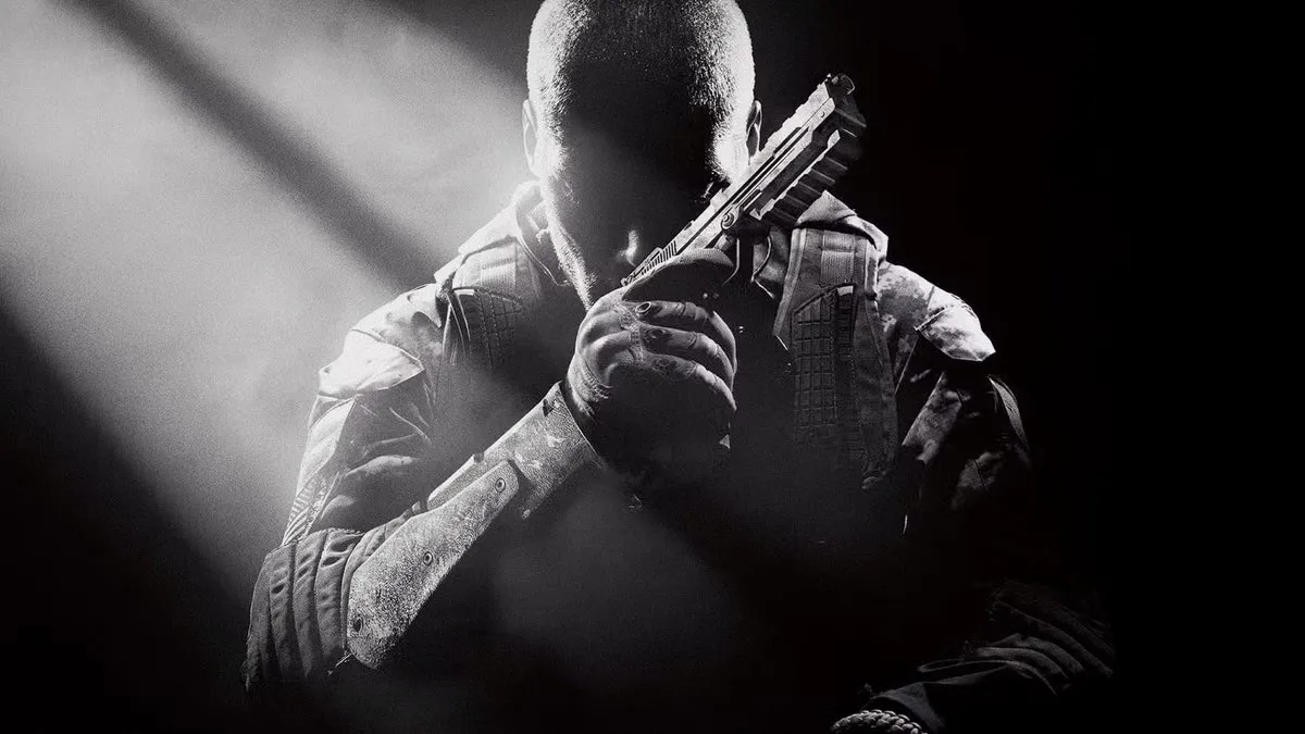 Call of Duty Black Ops 2 hero shot showing a soldier in shadow with a pistol near their face