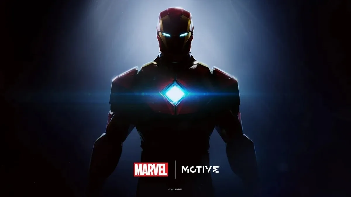 Iron Man promotional teaser image showing Tony Stark standing in front of his suit in a hangar