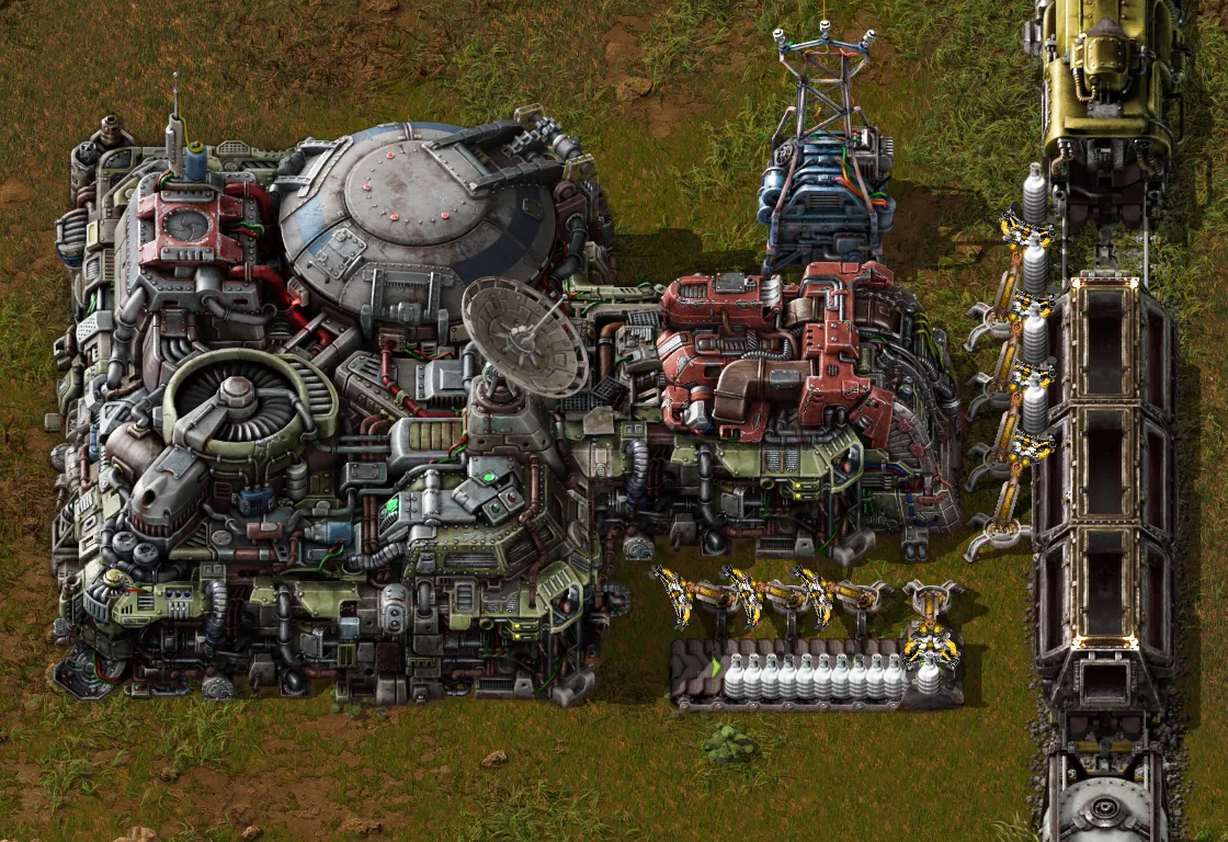 Factorio landing pad with the new unloading bay and inserters moving items onto belts