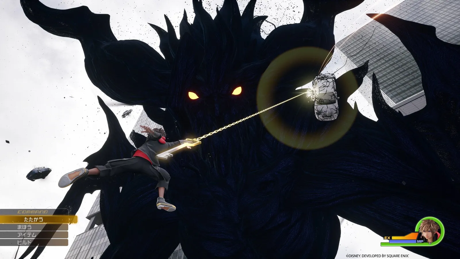 Sora fighting a giant Heartless-style foe inside the dense streets of Quadratum, with towering buildings lit up in pink and teal neon.