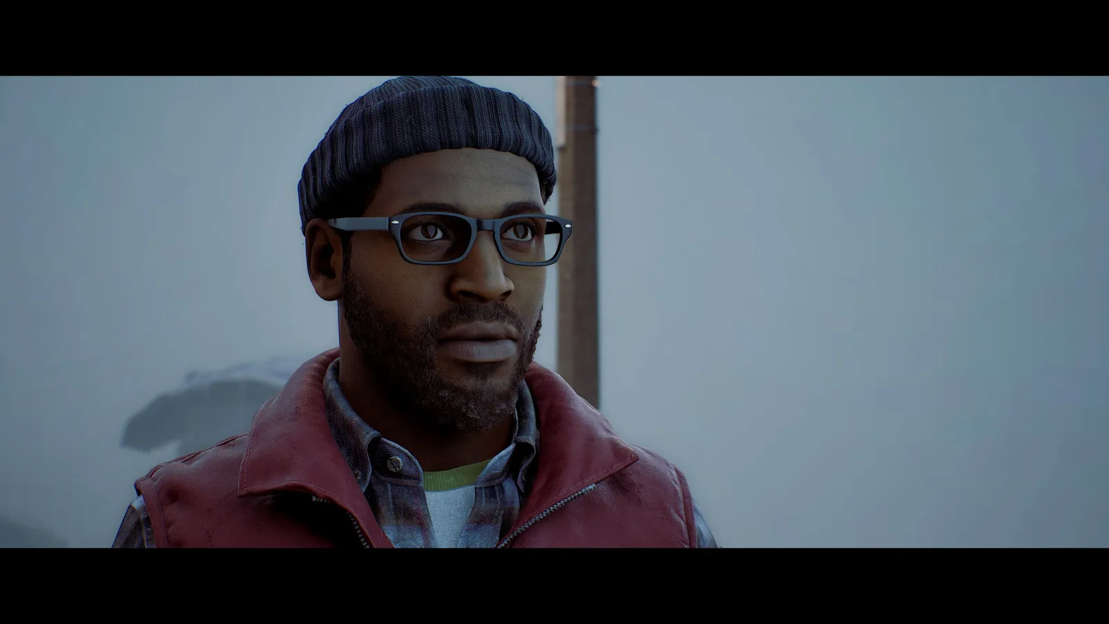 Simon Ordell standing in the dark interior of a SILENT HILL Townfall screenshot