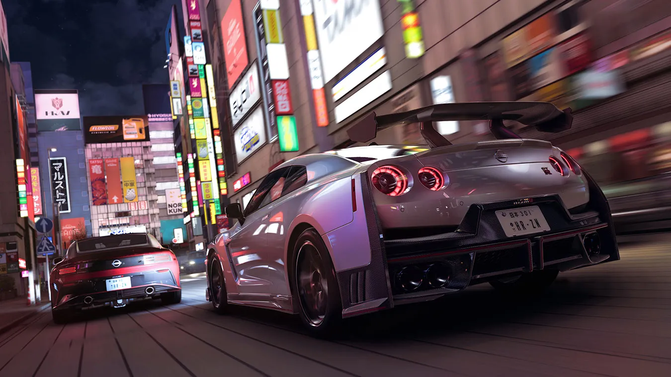 A silver Nissan GT-R NISMO and a red Nissan Z Nismo racing through Tokyo streets in Forza Horizon 6
