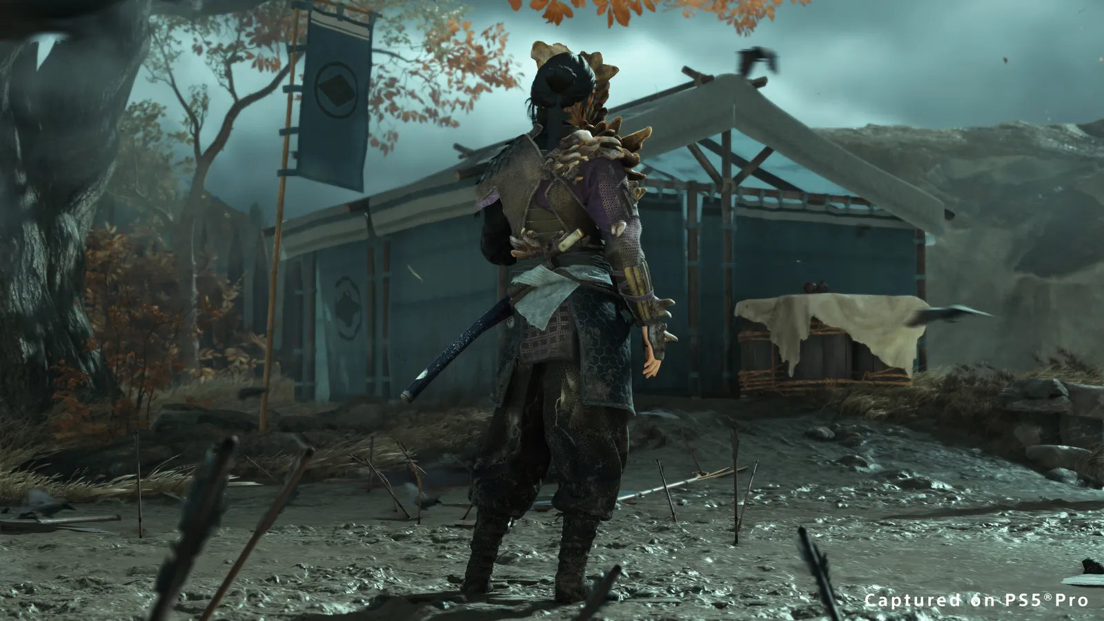 Ghost of Yotei Clicker armor back view showing The Last of Us crossover design