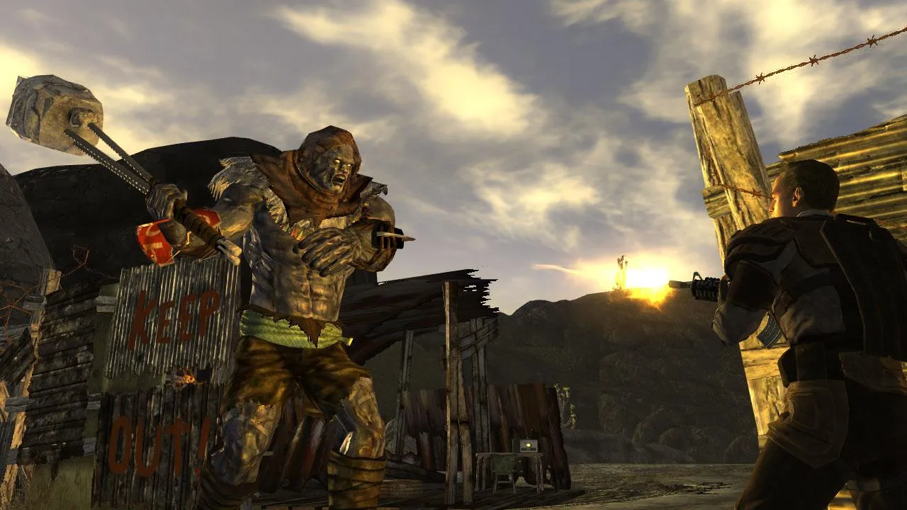 Fallout New Vegas desert landscape with the Mojave Wasteland at dusk, showing rocky terrain and a desolate road