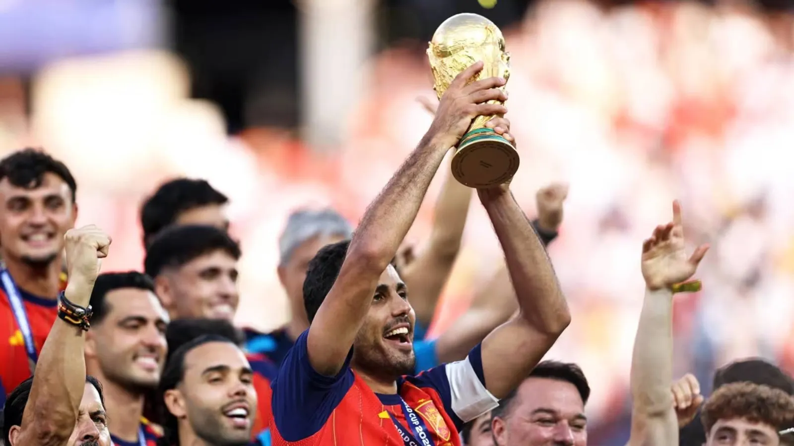 FIFA World Cup trophy held aloft under stadium lights after the 2026 final