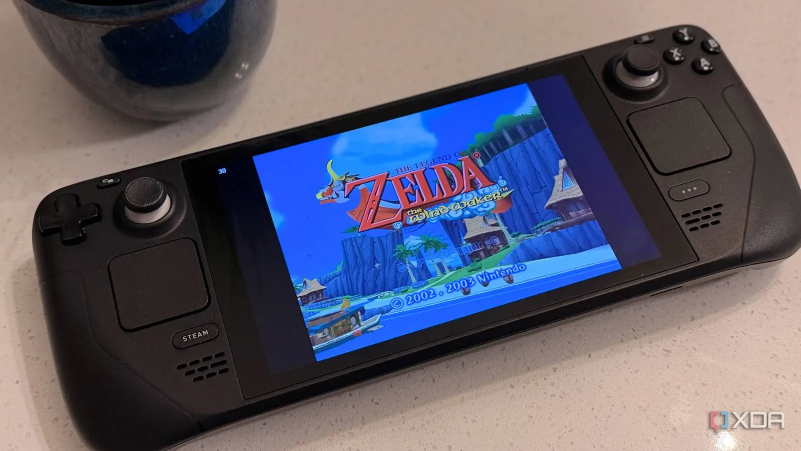 A Steam Deck handheld running a game emulator on its screen