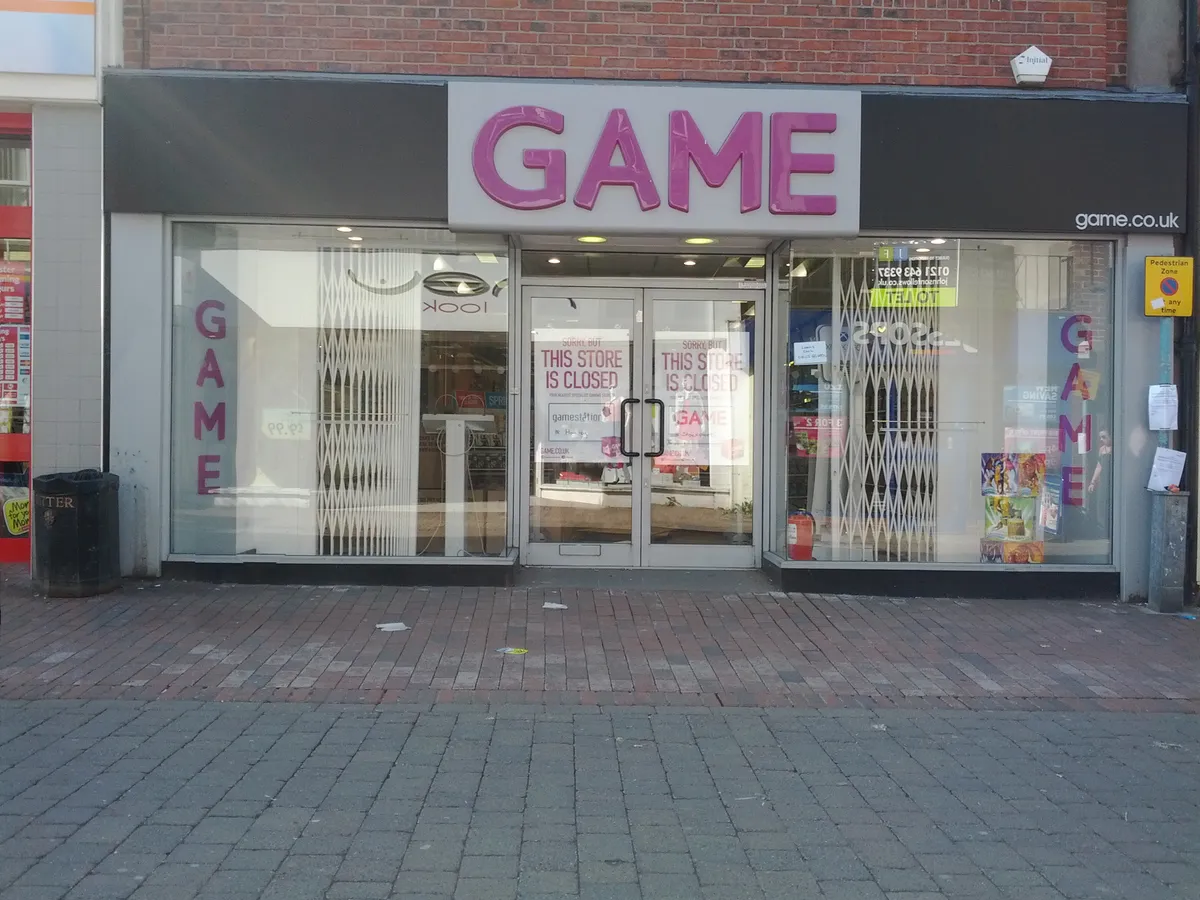 Closed GAME retail storefront in Macclesfield with administration notice in the window, March 2012
