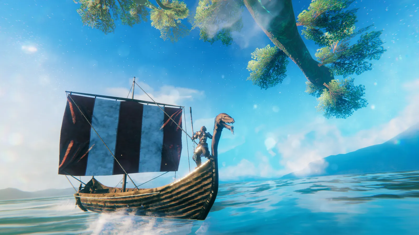 Valheim player character stands on a snow-covered cliff overlooking a dark fjord at dusk