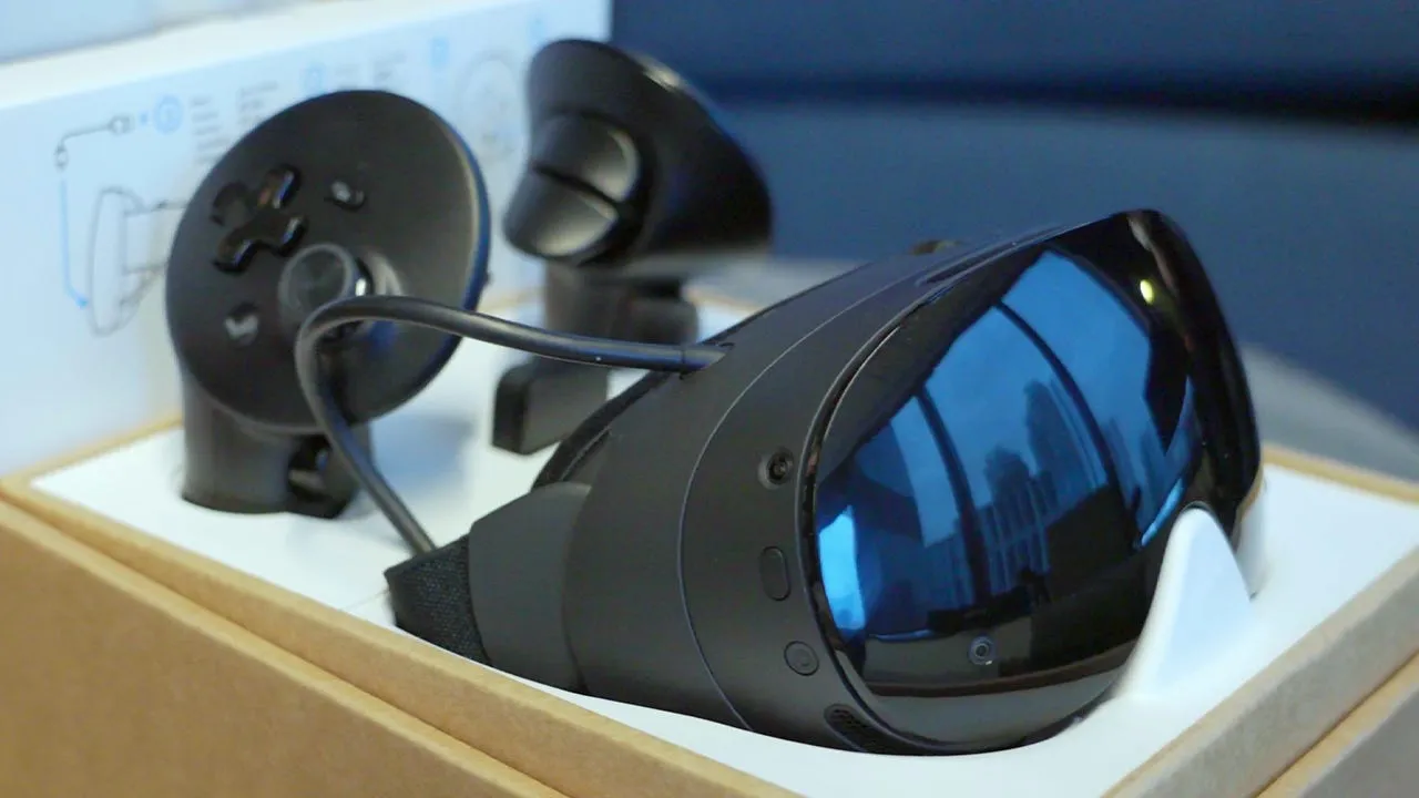 Steam Frame VR headset in its packaging as shown in Valve's leaked unboxing video, with the wireless dongle and accessories laid out beside it.