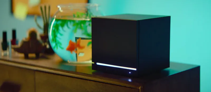 Steam Machine living room setup showing the compact console under a TV
