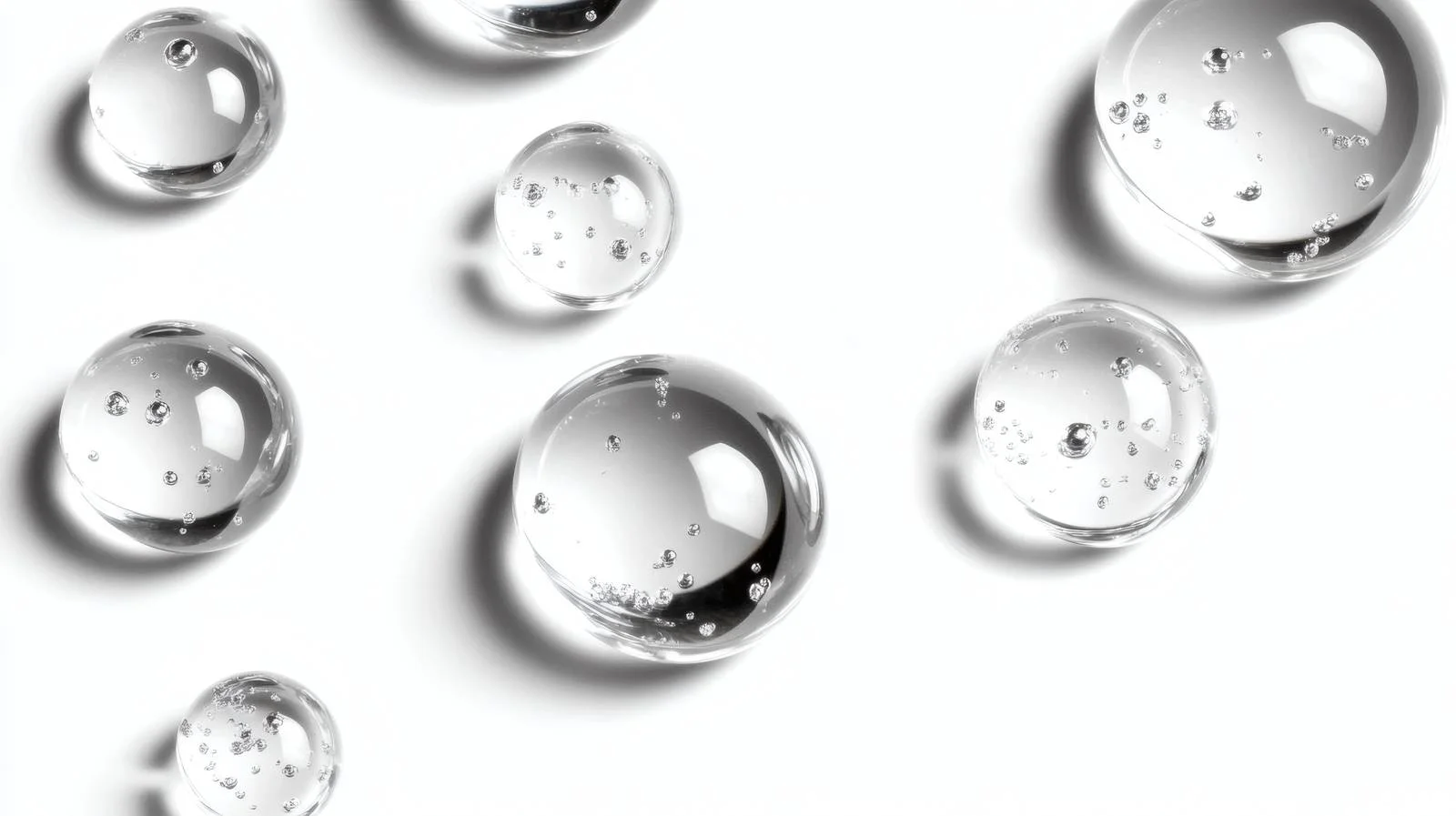 Transparent gel droplets on white surface — free download from Dotvec