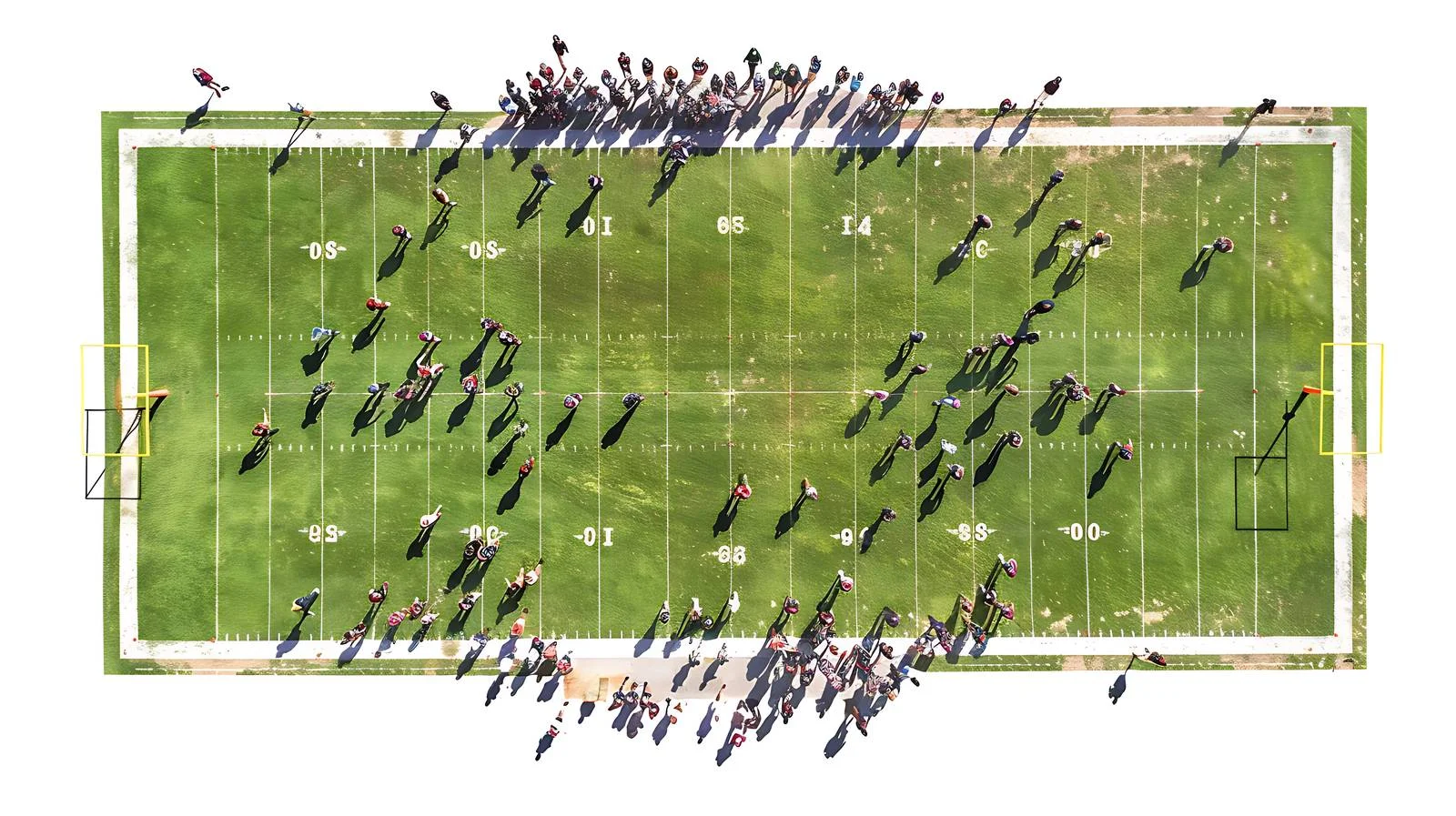 Aerial View of College Football Match on Yard Line — free download from Dotvec