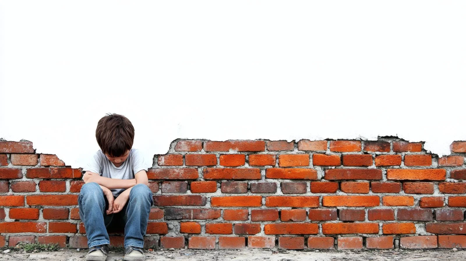 Young Depressed Child Against Brick Wall — free download from Dotvec