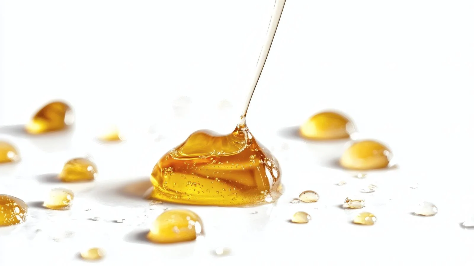 Glistening Honey Drops on White Background — free download from Dotvec