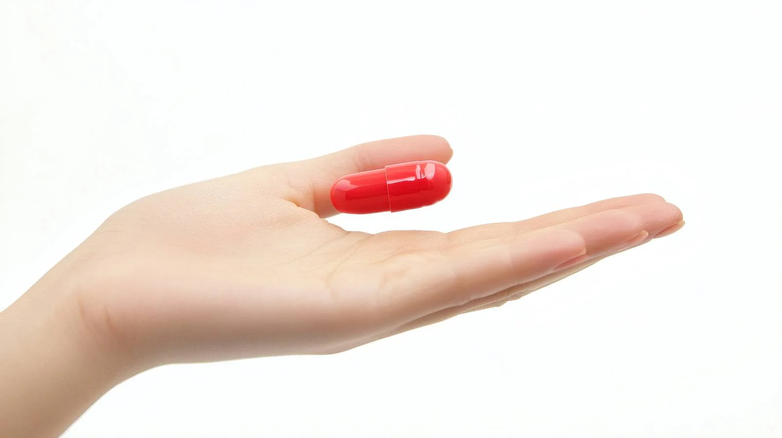 Medication Held Against Plain White Background — free download from Dotvec