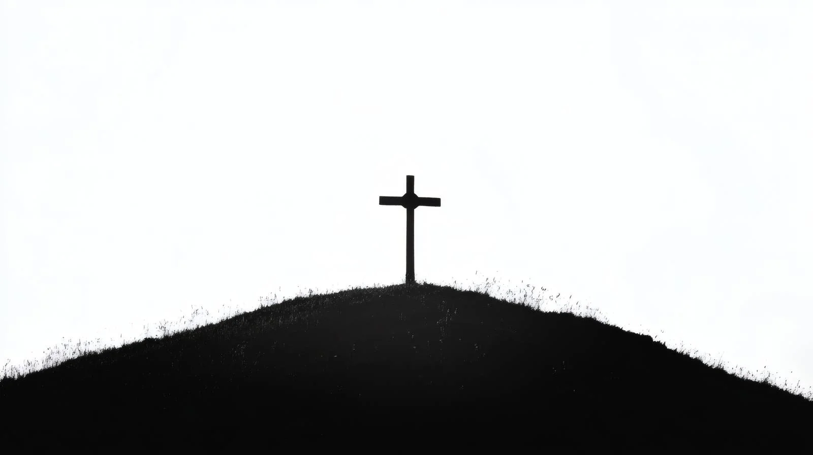 Crucifix Silhouette on Isolated Hilltop — free download from Dotvec