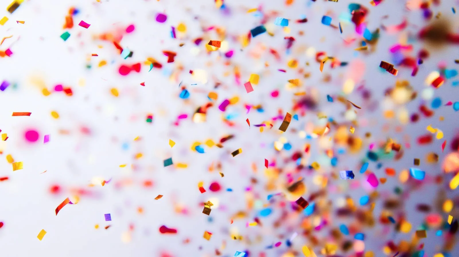 Colorful confetti on vibrant isolated background — free download from Dotvec