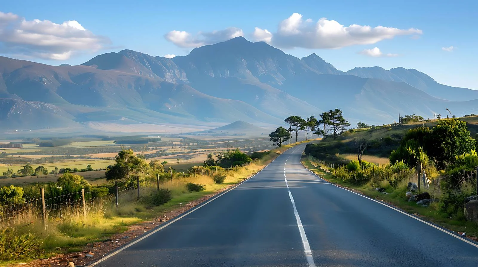 Tranquil road cutting through serene landscape — free download from Dotvec