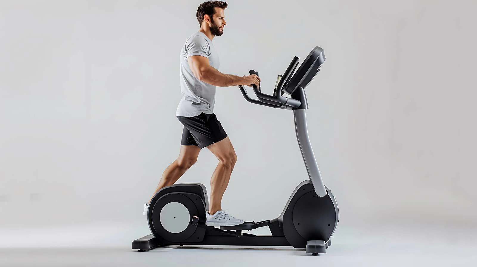 Man on Elliptical Trainer at Fitness Gym — free download from Dotvec