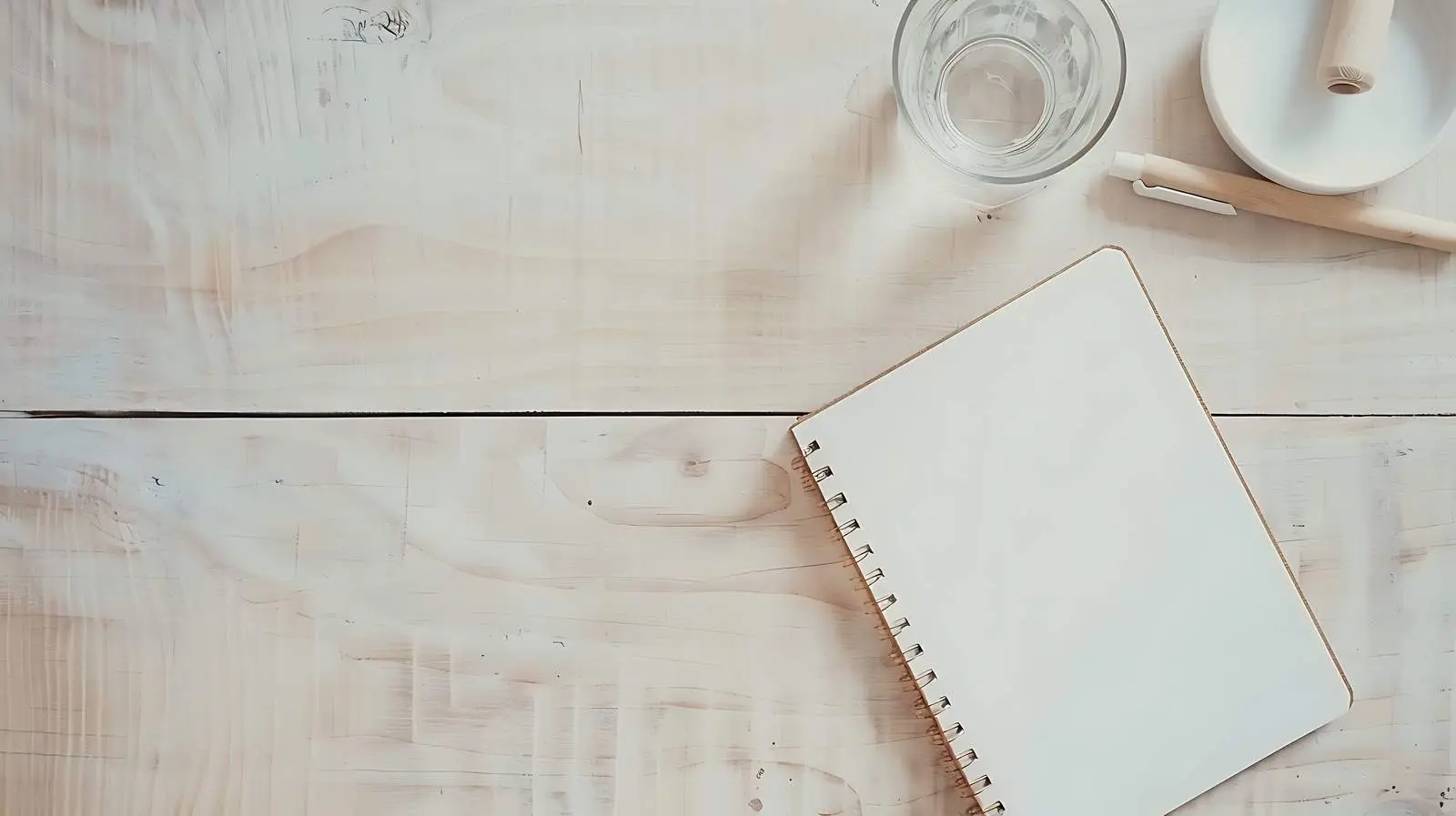 Minimalist Notebook and Glass of Water Setup — free download from Dotvec