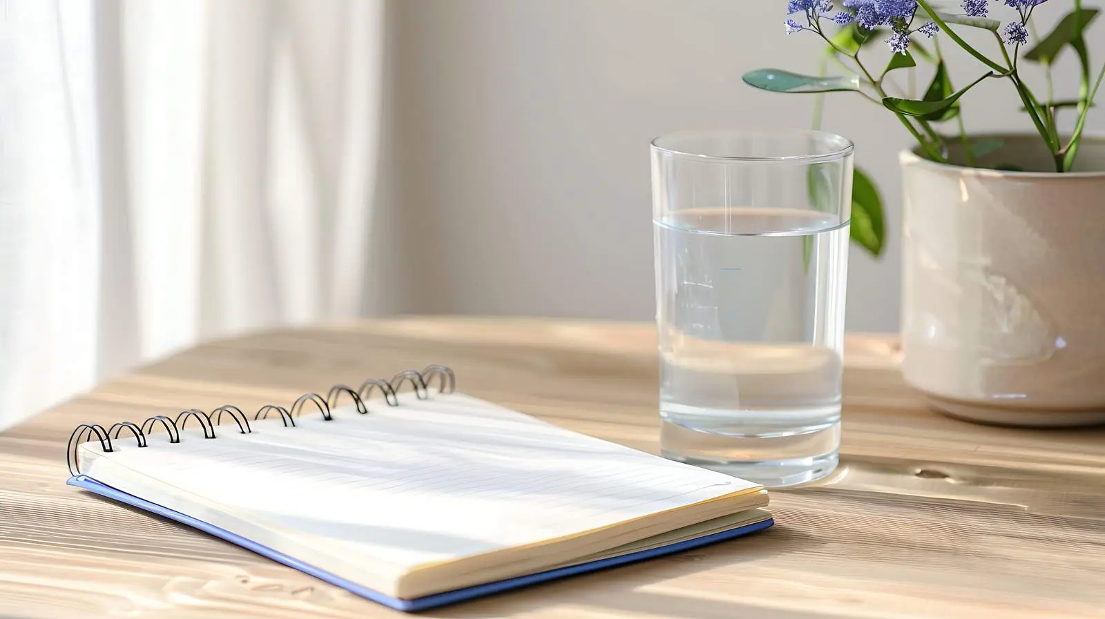 Aesthetic Minimalist Notebook and Glass of Water — free download from Dotvec