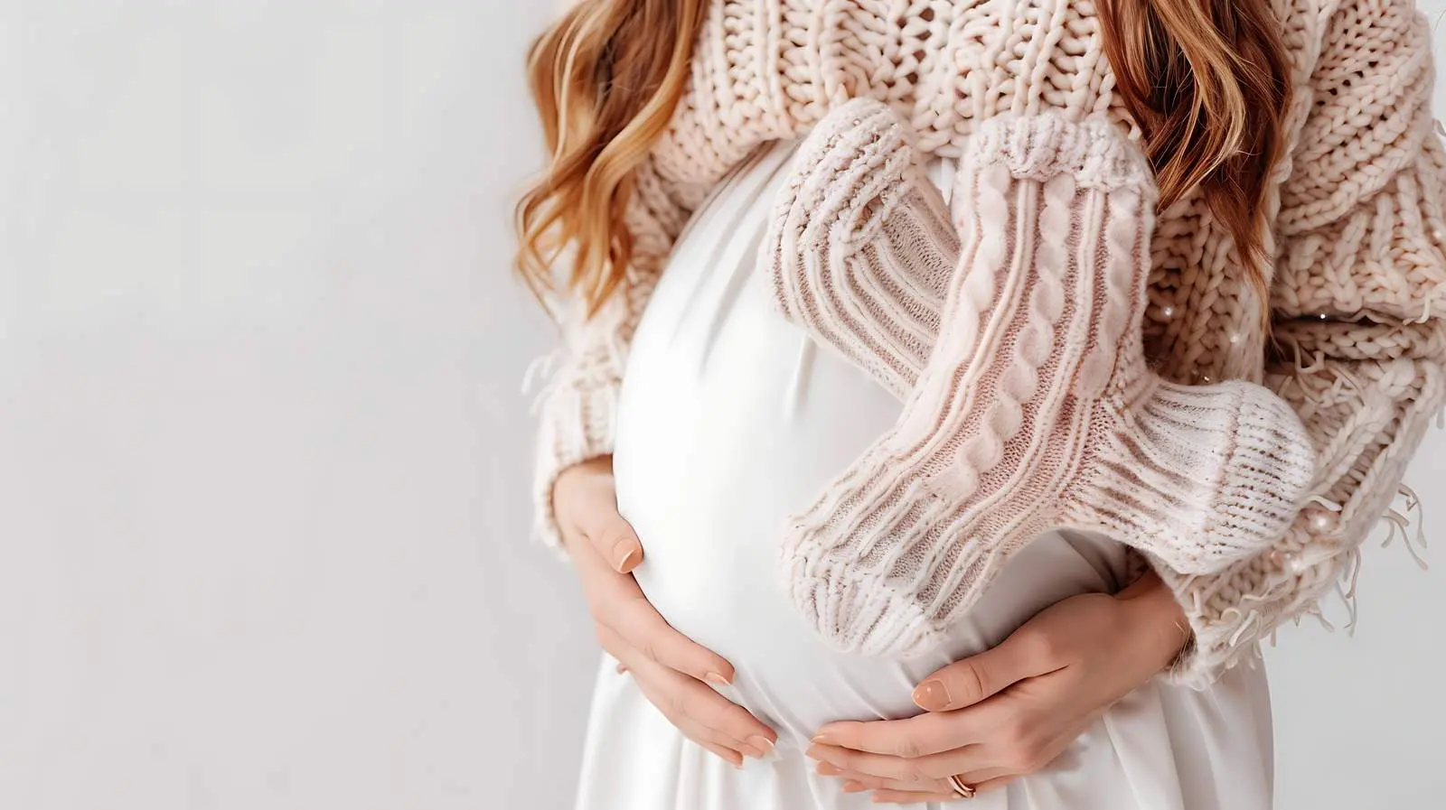 Pregnant Woman Holding Knitted Baby Socks – free patio image from Dotvec