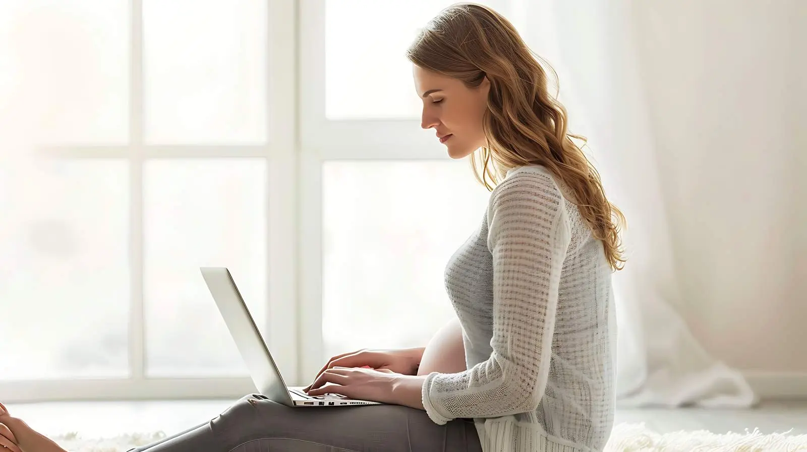 Pregnant Woman Working on Laptop — free download from Dotvec